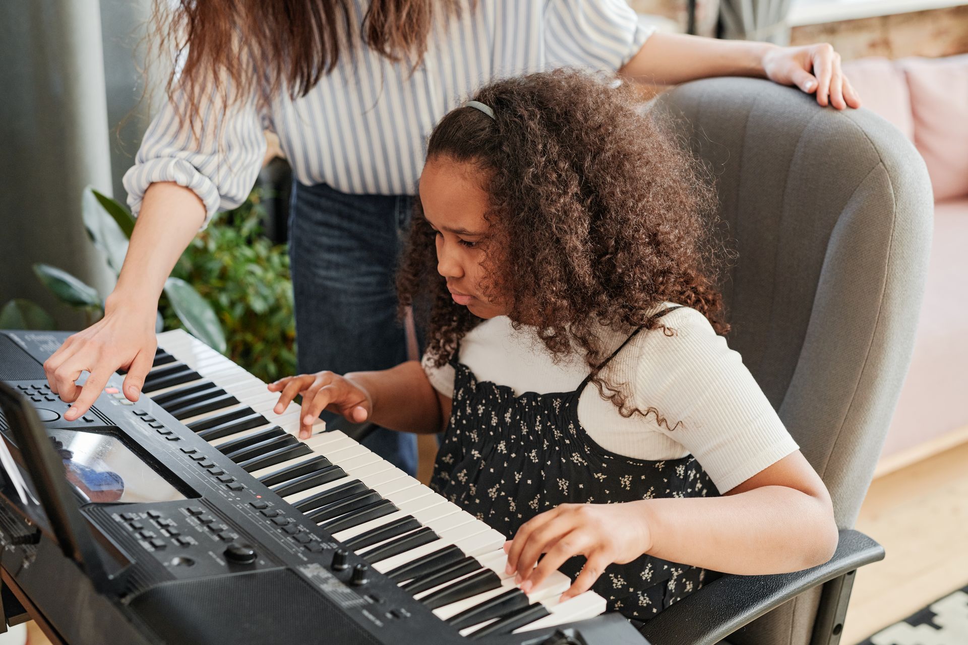 Piano lesson with teacher and student at YOMA Music Academy