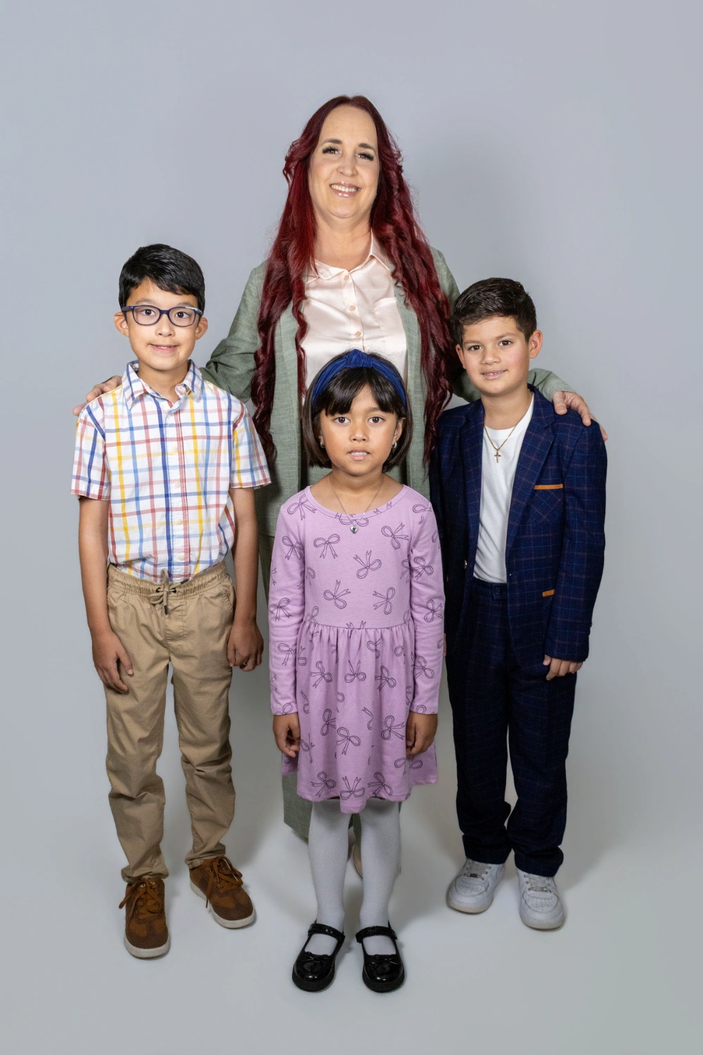 Yarima Orellana with three children at YOMA Music Academy